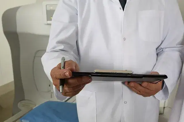 A Physiotattva clinician with a patient chart